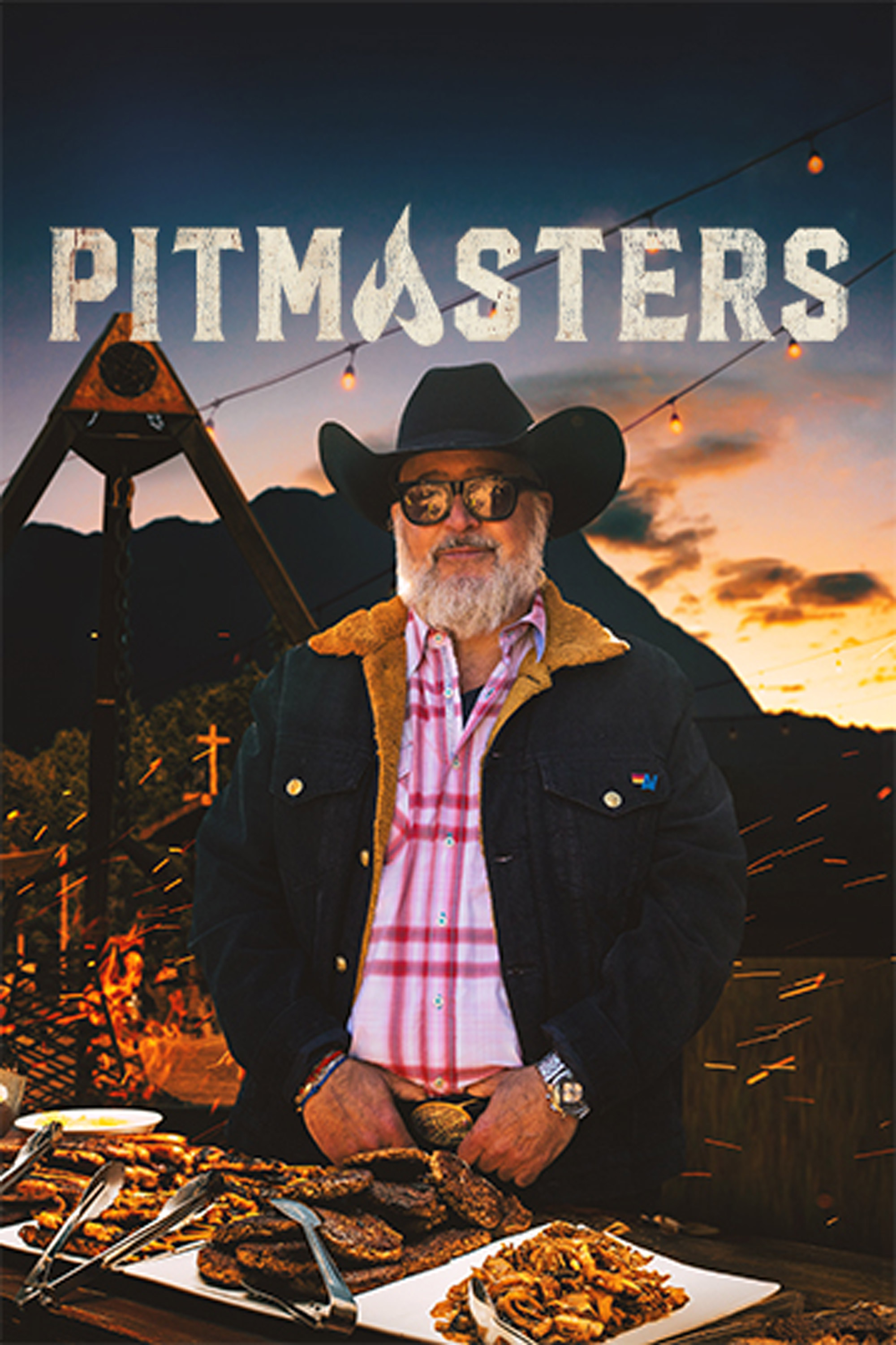 Pitmasters: show poster featuring a bearded man in a cowboy hat in front of a fire pit with string lights and grilled food.